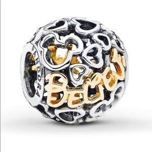 Pandora two tone  gold and silver Believe Charm